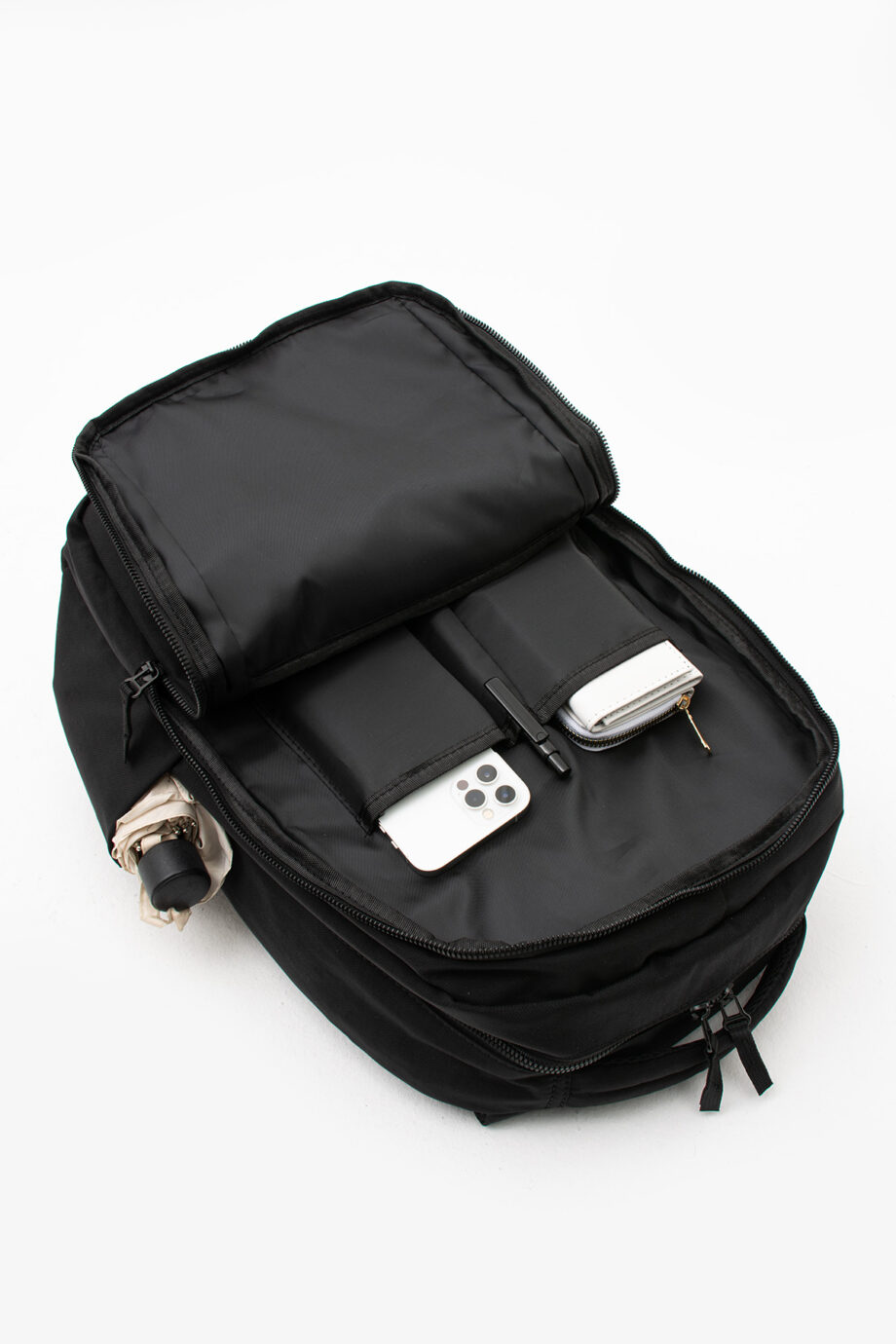 Interior view of Sanmorris backpack showing zippered compartments