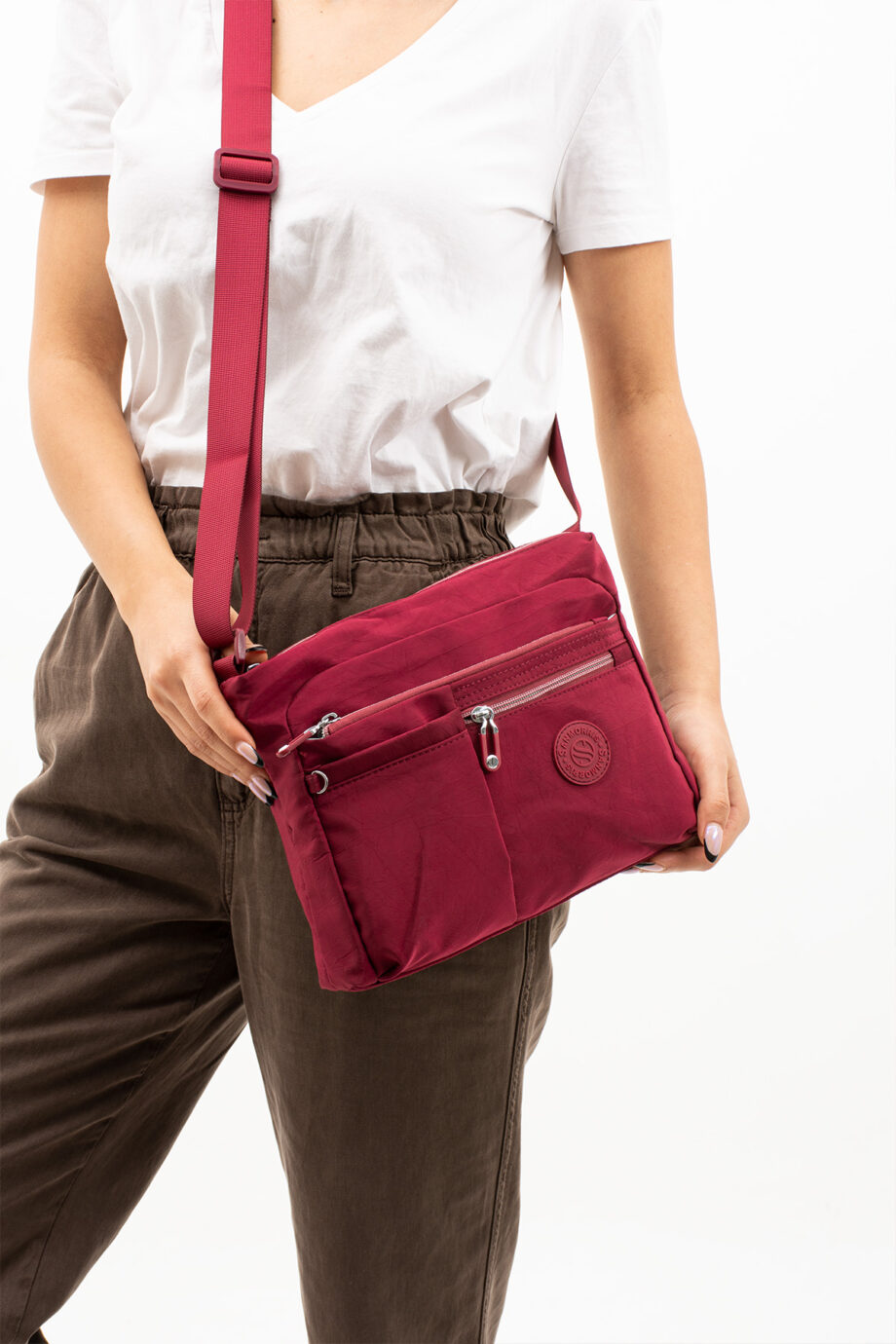 Sanmorris multi-pocket water-resistant krinkled fabric crossbody bag, showcasing its various compartments and stylish design.