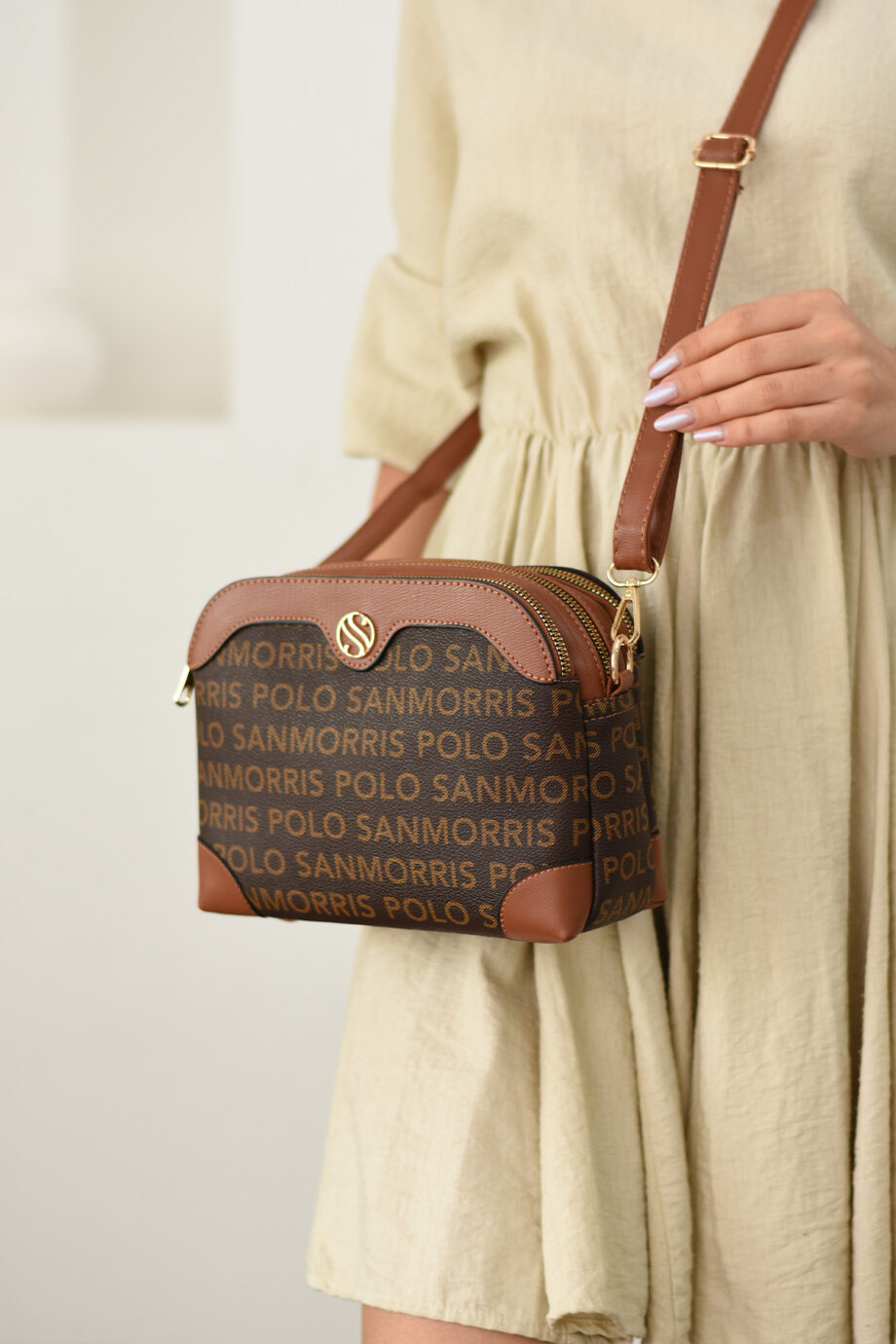 The Sanmorris crossbody bag styled with a casual outfit, showcasing its compatibility with daily looks.