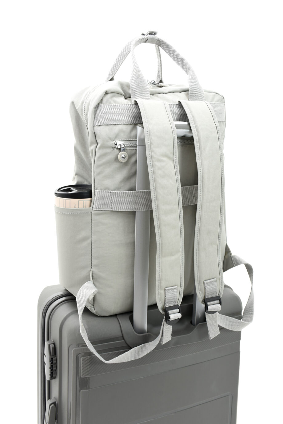 Sanmorris backpack with a back strap for attaching to wheeled luggage